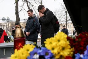 Laying flowers on the Heroes of Heaven's Hundred Alley