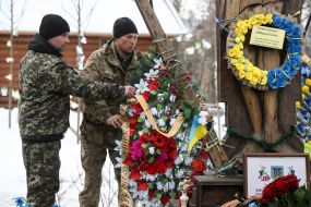 Laying flowers on the Heroes of Heaven's Hundred Alley