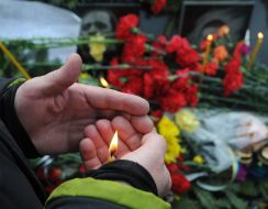 A man holds a candle