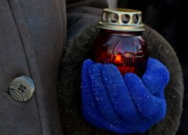 The woman holds the lamp