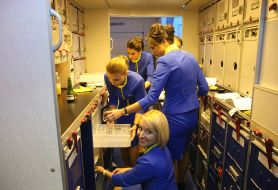 Stewardess in the kitchen on the plane