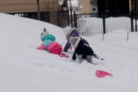 Children play in the snow