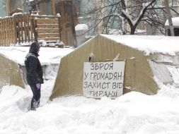 Law enforcers conduct investigative actions in a tent camp