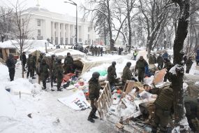 Law enforcers dismantle the tent camp near the VRU