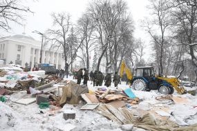 Law enforcers dismantle the tent camp near the VRU