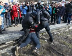 Law enforcers detain a man