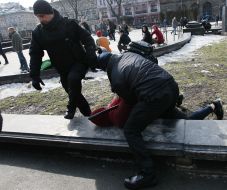 Law enforcers detain a man