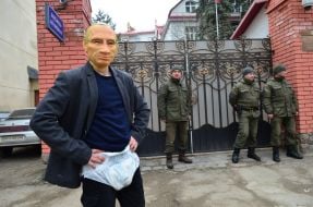 Participant of the action in Putin's mask