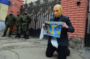 Participant of the action in Putin's mask