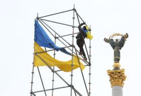 The man climbed the metal structure