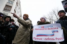 Participant of the protest against the holding of elections