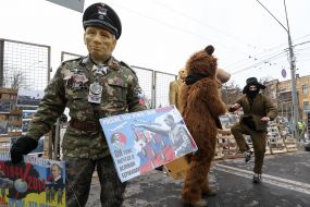Participant of the action in Putin's mask