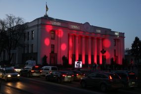 The building of Verkhovna Rada in red illumination