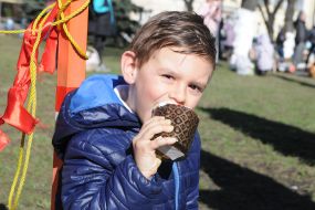 The boy is eating Easter cake