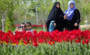 People walk in the Flower Garden