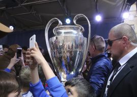 Children make selfie with cup of Champions League