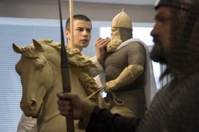 Vasily Virastyuk poses to sculptor Volodymyr Zhuravel