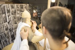 Vasily Virastyuk poses to sculptor Volodymyr Zhuravel