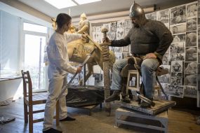 Vasily Virastyuk poses to sculptor Volodymyr Zhuravel