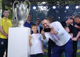 Andrei Pavelko is photographed with a boy