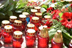 Candles near the Memorial Cross