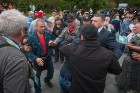 Police detain the offender