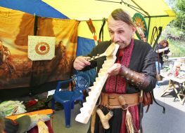 Folk craftsman with a wooden iron