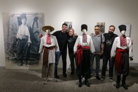 Visitors to the exhibition are photographed with exhibits
