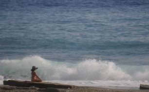 The girl is resting on the beach in Alanya (Turkey)