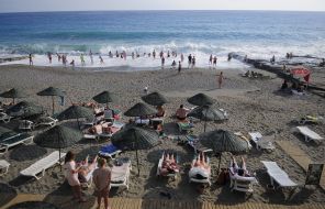 People rest on the beach in Alanya (Turkey)
