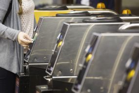 The girl passes through the turnstile