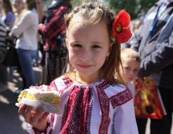 The girl is eating a cake
