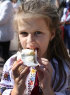The girl is eating a cake