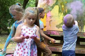 Children draw on the canvas