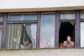 Patients look through the window