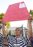 The participant of the action holds a huge red card