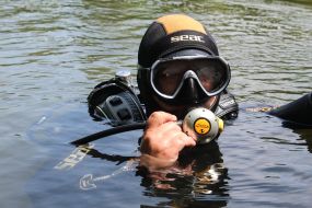 Pyrotechnicians examine the water area of the Seversky Donets River