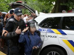 A boy is photographed with a policeman