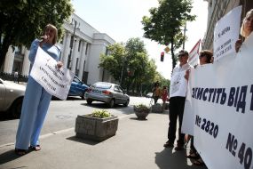 Participants of the action hold posters