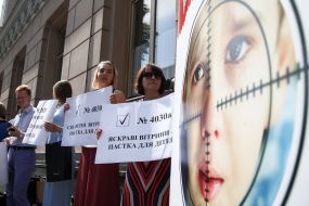 Participants of the action hold posters