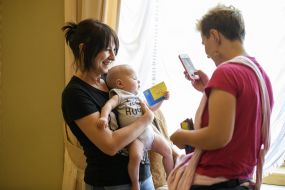 The child holds a temporary pass