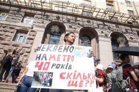 A man holds a poster