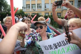 A participant of the action takes money