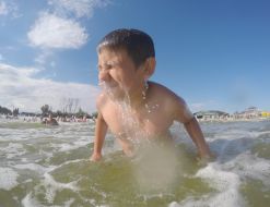 The boy is bathed in the sea