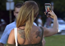Participant in flash mob of femininity make selfie