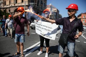 Activists with posters and fayers on the roadway