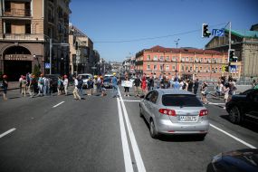 Activists with posters on the roadway