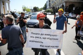 Activist with a poster on the carriageway