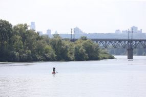 Anton Bondarenko on the SUP-board sails on the Dnieper