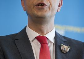 The badge with the image of a bear on the jacket of Vladimir Omelyan